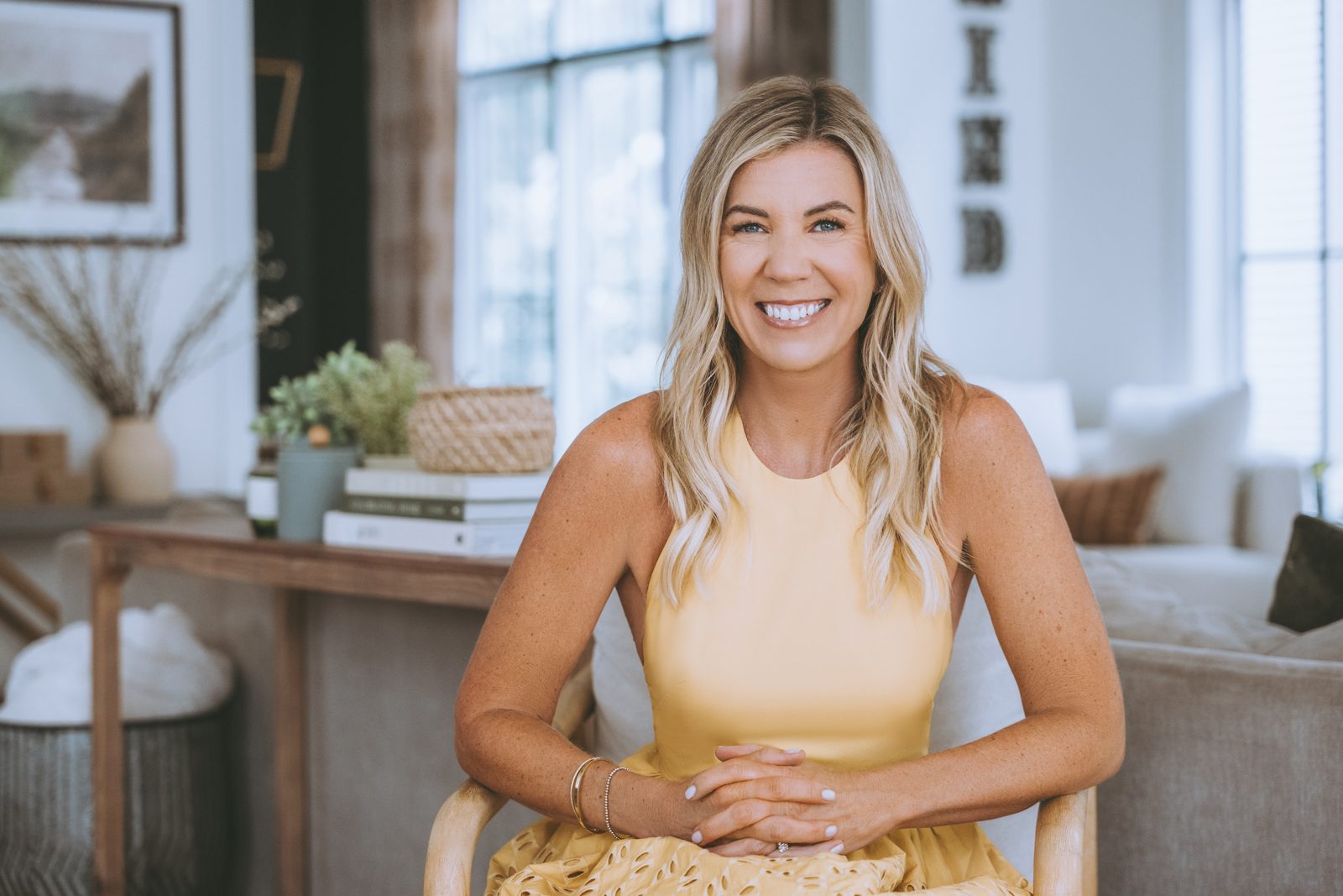 Steffani smiling, seated at home